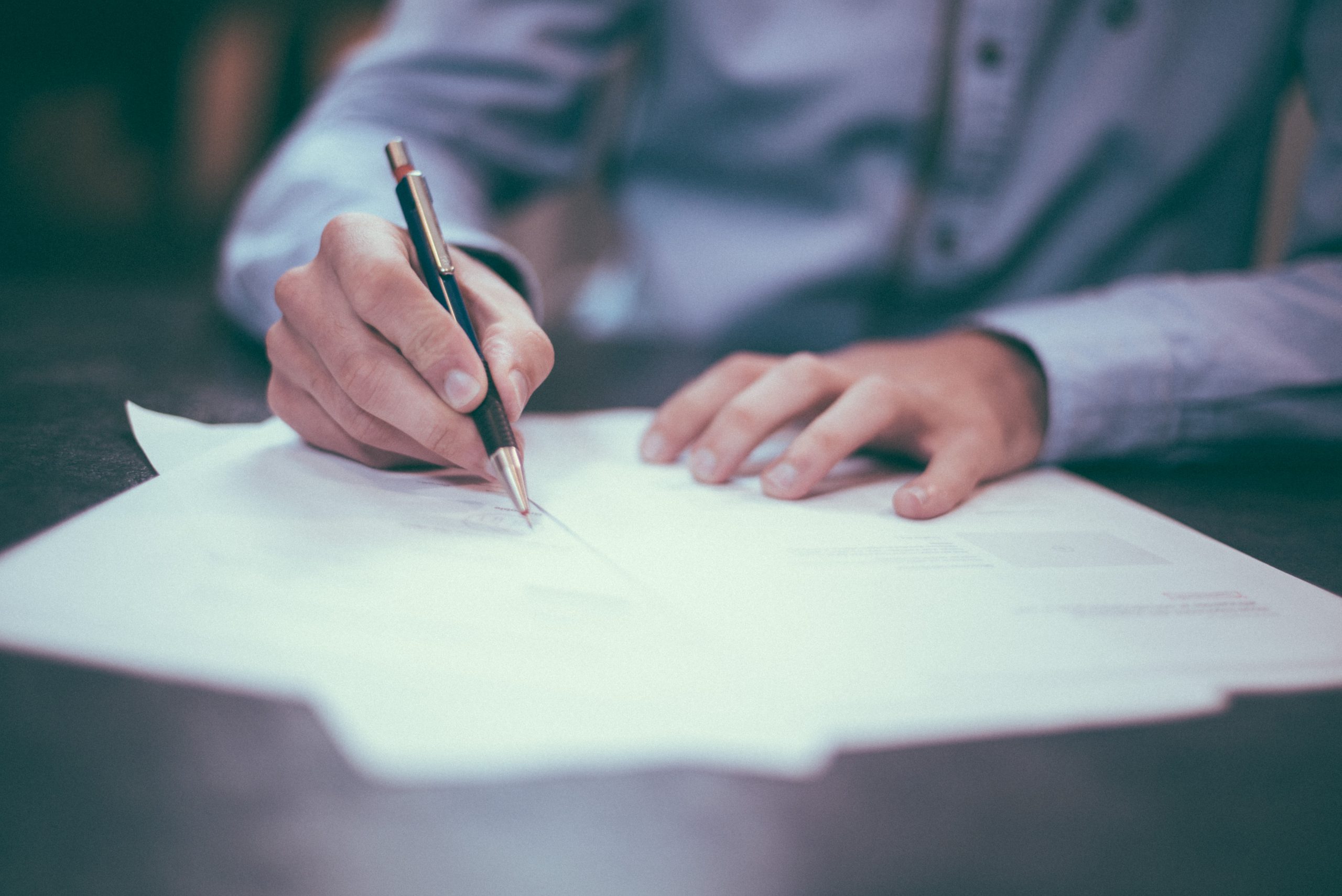 signing a paper contract